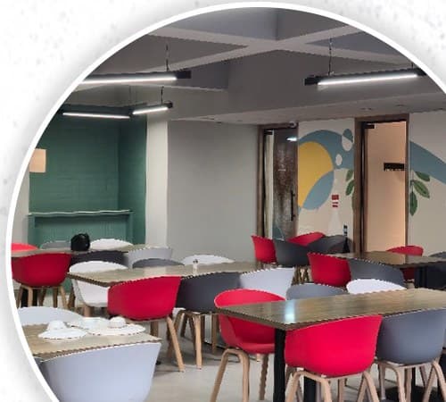 Common dining hall with red and grey chairs