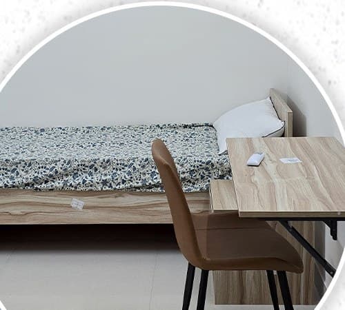 Room with a bed, desk and chair