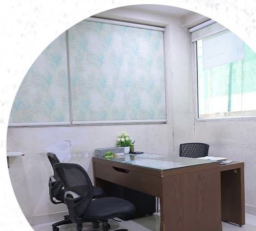 Room with a study desk and chair beside a window